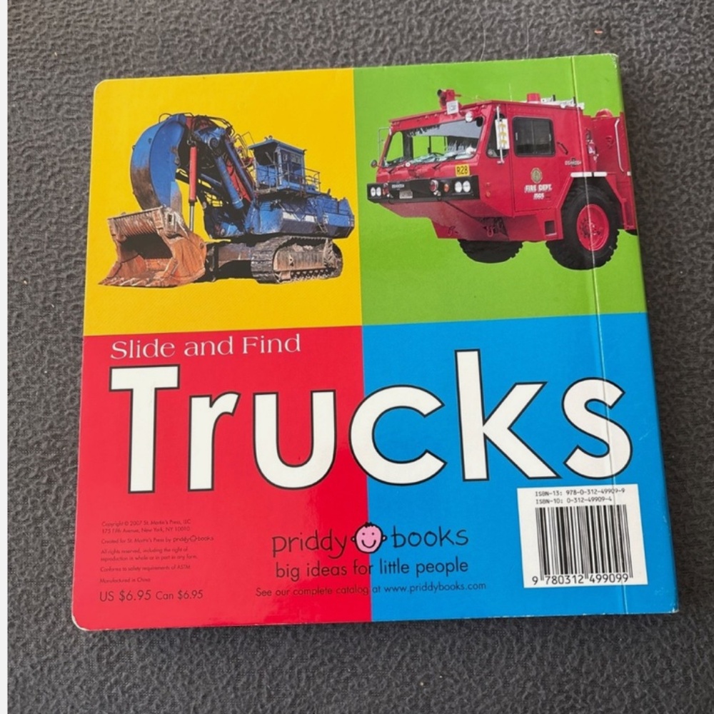 Children’s slide and find trucks book